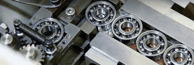 a bunch of bearings are lined up in a row on a machine