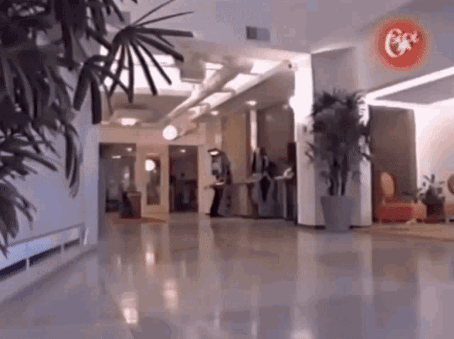 a hallway with a red sign that says coca cola