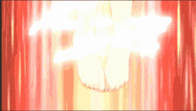 a woman 's feet are glowing in a red and yellow background