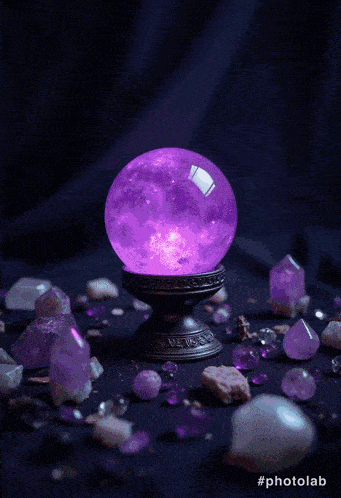 a purple crystal ball is surrounded by purple rocks and crystals