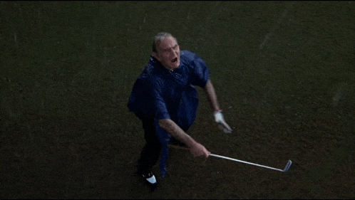 a man in a blue cape is holding a golf club and says " rat farts " in yellow letters