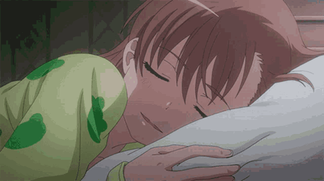 a girl is sleeping with her head on a pillow