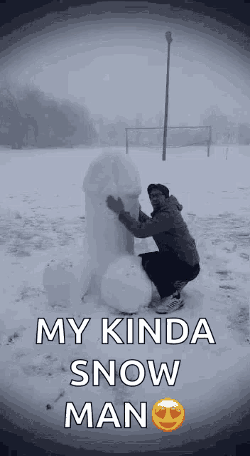a man is kneeling down next to a snowman that says my kinda snow man on it