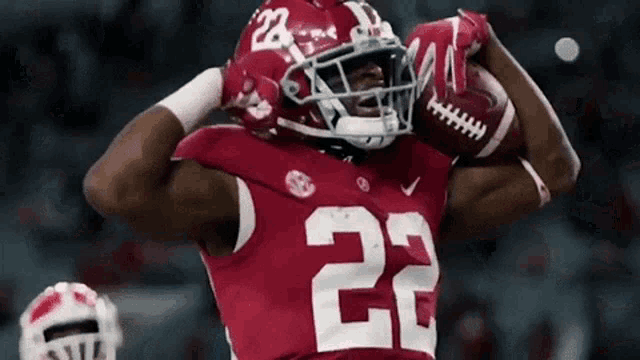 a football player in a red uniform with the number 22 on it