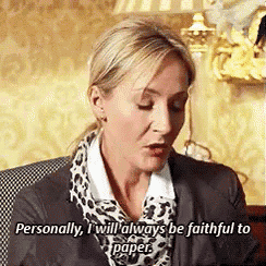 a woman is sitting in a chair and talking about being faithful to paper .