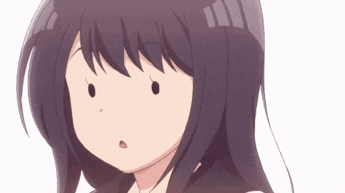a close up of a cartoon girl 's face with a surprised look on her face .