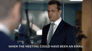 a man in a suit and tie is standing next to another man in an office .