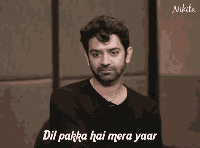 a man wearing a black shirt with the words dil pakka hai mera yaar