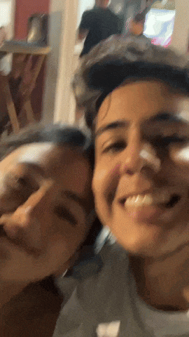 a man and a woman are smiling for a picture together
