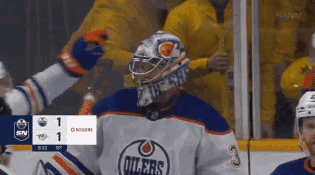 a hockey game is being played between the oilers and rogers