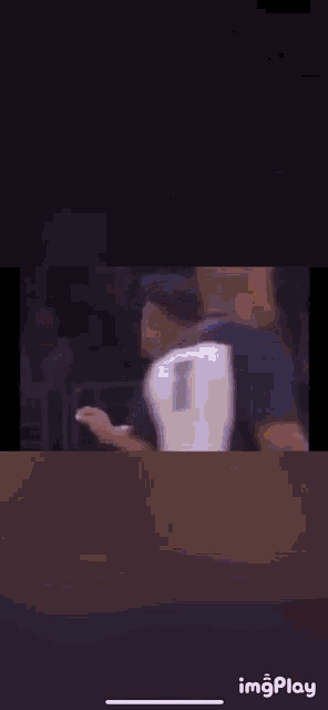 a basketball player in a lakers jersey is standing next to another player in a blue jersey .