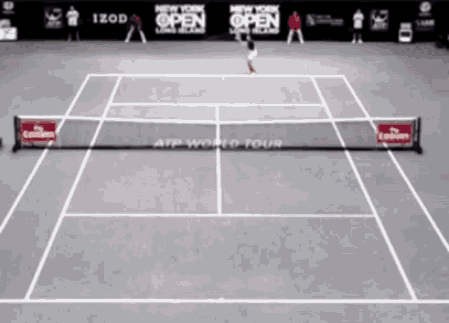 a tennis court with a sign that says izod on it