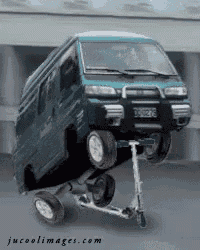 a van is sitting on top of a scooter with jucoolimages.com written on the bottom right