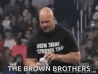 a bald man wearing a black shirt that says been there stroyed that is holding a can of beer .
