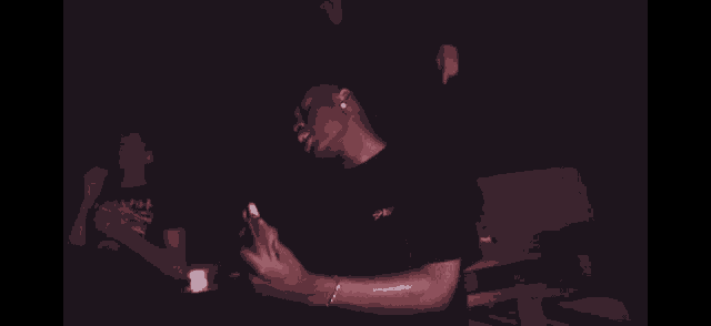 a man in a black t-shirt with a sticker on it that says ' sd ' on it