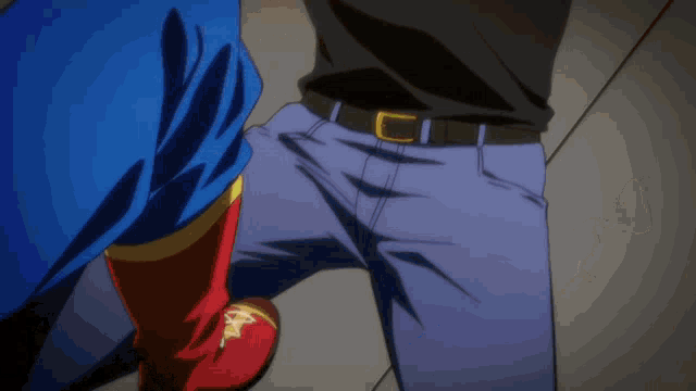 a blurry picture of a person in a blue and red outfit