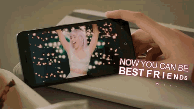 a person is holding a cell phone with the words now you can be best friends on the screen