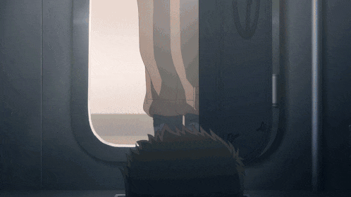 a person is standing in a doorway with their feet up