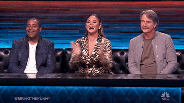 three people are sitting at a table with the words bring the funny on the back