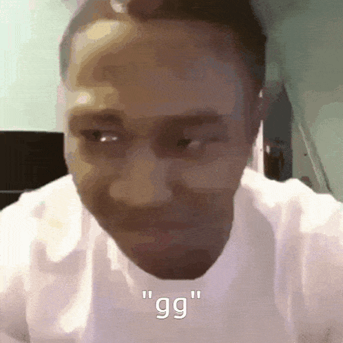 a close up of a man 's face with the words " gg " above him