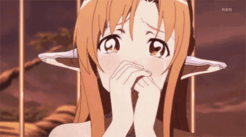 a girl with elf ears covering her face with her hands