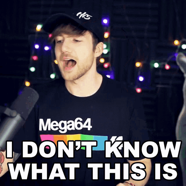 a man wearing a mega64 t-shirt says i don 't know what this is