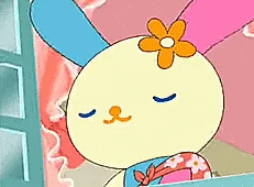 a cartoon rabbit with a flower on its head is sleeping on a window sill .