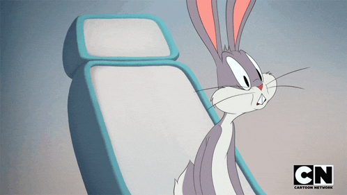 bugs bunny sitting in a chair with cn cartoon network written on the bottom