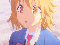 a close up of a girl in a blue suit and pink tie