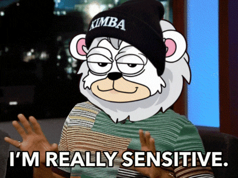 a cartoon bear wearing a beanie that says kimba