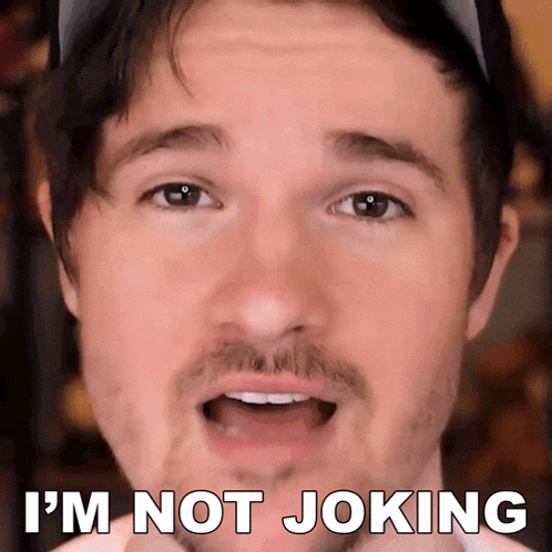 a man with a beard is making a funny face and saying " i 'm not joking "