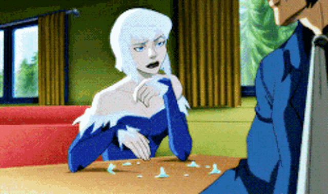 a cartoon character is sitting at a table with a man
