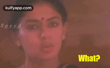 a close up of a woman 's face with the words what in yellow