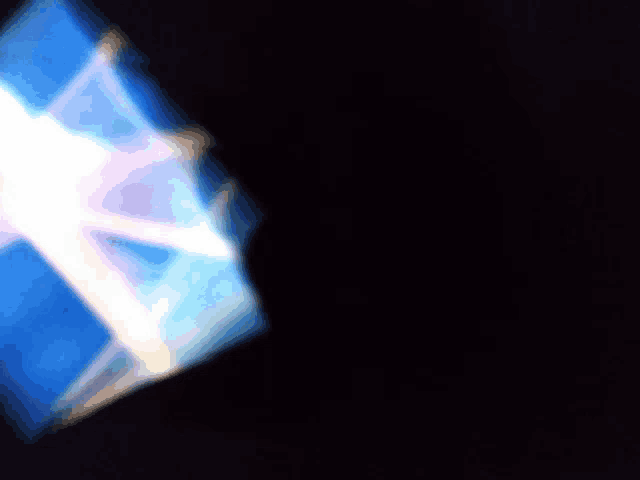 a blurry picture of a light coming out of a square