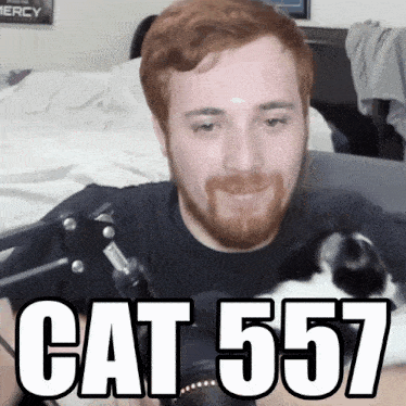 a man with a beard and a cat that says cat557 on the bottom