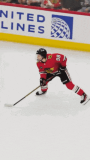 a hockey player with the number 18 on his shirt