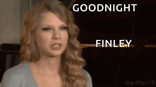 taylor swift is making a funny face while talking to finnley .
