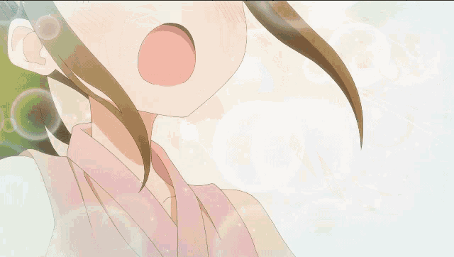a close up of a girl 's face with a surprised look on her face
