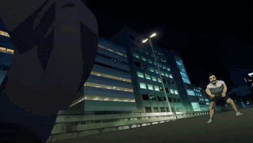 a man in a white shirt is standing in front of a building with a blue light coming out of it