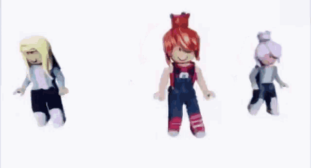 a group of three dolls are dancing together on a white background .