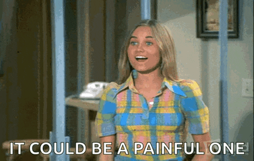 a woman in a plaid shirt is saying it could be a painful one