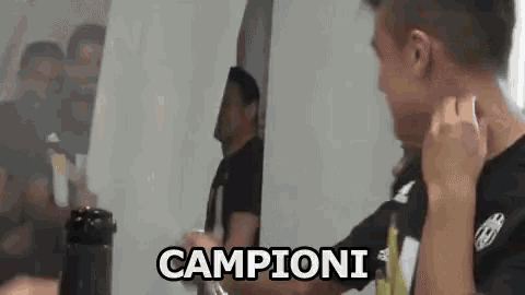 a man is standing in front of a mirror with the word campioni written on the bottom .