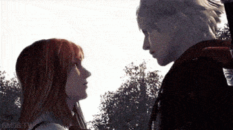 a man and a woman are looking into each other 's eyes in a video game .