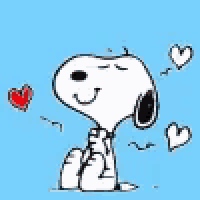 snoopy is sitting on the ground with his eyes closed and hearts around him on a blue background .