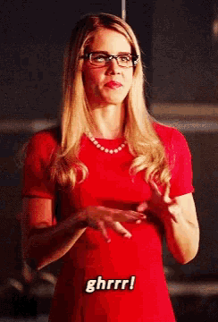 a woman in a red dress says ghrrr