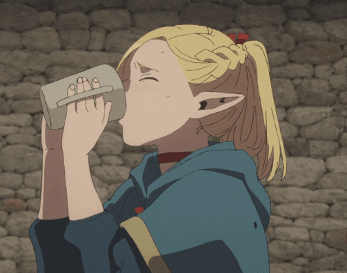 a girl drinking from a cup with the letters aaa on it