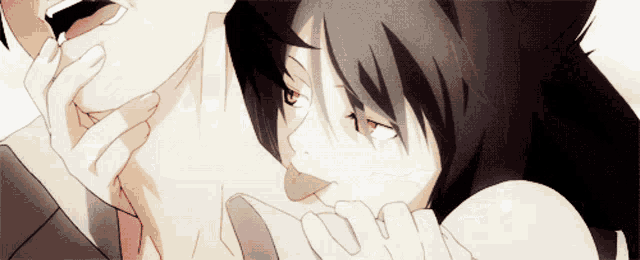 a man and a woman are kissing with the woman licking the man 's neck