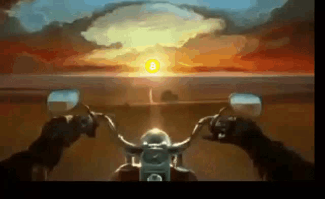 a person is riding a motorcycle in front of a nuclear explosion