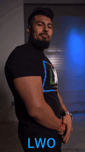 a man with a beard wearing a black shirt with the word lwo on it
