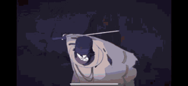 a man in a hat is holding a sword in his hand .